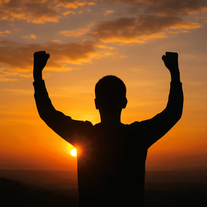 A confident person standing tall in sunlight with self-belief